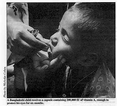 A Bangladeshi child receives a capsule containing 200,000 IU of vitamin A, enough to protect his eyes for six months.