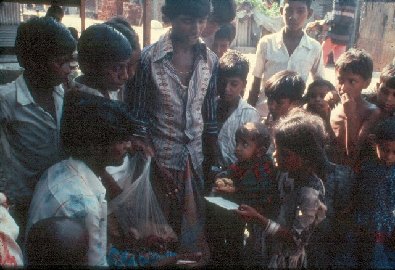 Food distribution to children- slide 39 - A Kind of Living