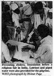 Preventing cholera. Inoculation before a religious fair in India.