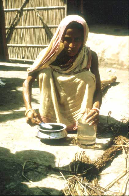 Slide 26 - This is a picture of a mother preparing oral rehydration solution from a simple salt and sugar mixture and water. Like ORS, salt and sugar solutions should be made fresh every day, covered, and stored in a cool place.