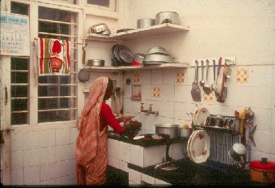 Woman at kitchen sink- slide 32 - A Kind of Living